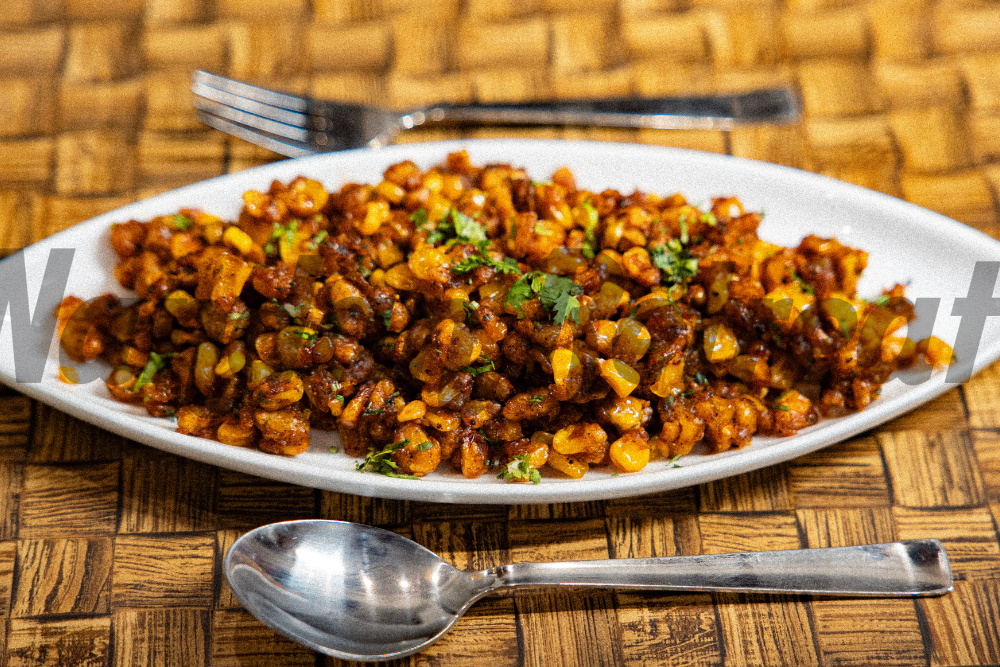 Gourmet dish at Flavours on Flames gourmet dining at Nandan Retreat in Vrindavan with premium ingredients